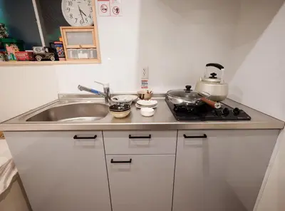 a kitchen counter with a sink and a stove at Live in Ginza 70 square meters, 2 bedrooms, 1kitchen 4toilet 2bath,room, project in Tokyo