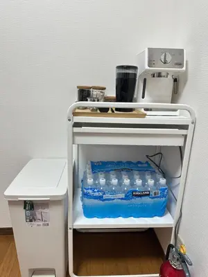 a shelf with aillion bottles of water in a refrigerator at Mark\u7684\u5c0f\u5ca9\u6c11\u5bbf in Tokyo