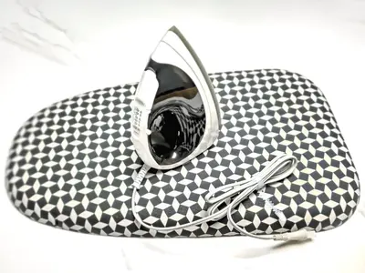 a black and white checkered purse with a zipper at YayoiHotel in Tokyo