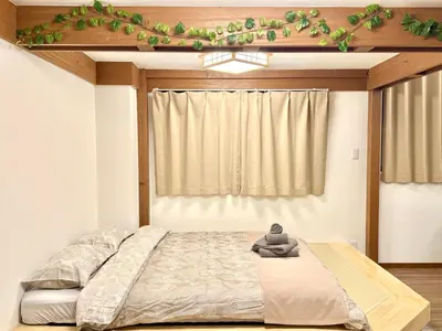a bedroom with a bed and a window at Tokyo Life hotel in Tokyo
