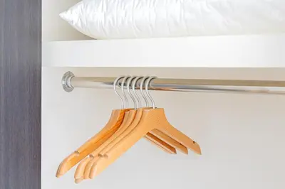 a bunch of wooden hangers hanging from a drawer at SQ312-5 mins Shibuya Station JR Yamanote - Max 2 in Tokyo