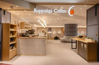 a coffee shop with a sign on the wall at Hotel Mariners Court Tokyo in Tokyo