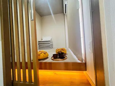 a hallway with two pumpkins sitting on a bed at New open ikebukuro Fangfun3 in Tokyo