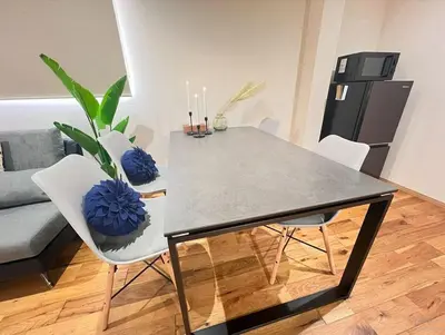 a dining table and chairs in a living room at New open ikebukuro Fangfun3 in Tokyo