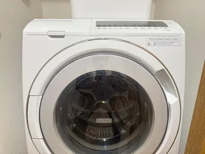 a white washing machine with its door open at New open ikebukuro Fangfun3 in Tokyo