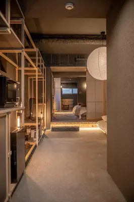 a view of a room with a bed and a kitchen at Mi-Kan Design Hotel in Tokyo