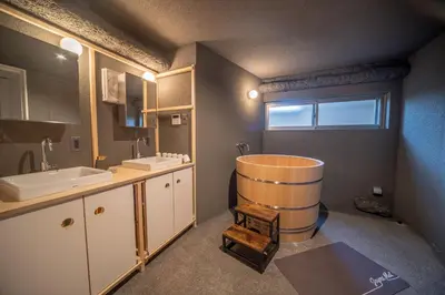 a bathroom with a sink and a tub at Mi-Kan Design Hotel in Tokyo