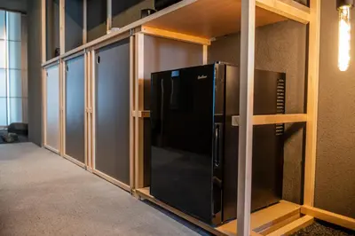 a room with a tv inside of a wall at Mi-Kan Design Hotel in Tokyo
