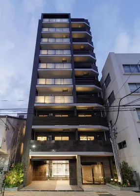 a tall black apartment building with a lot of windows at ROLES Ryusen 1001 in Tokyo