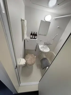 a small bathroom with a sink and a toilet at xinsuyuyuan in Tokyo