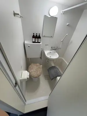 a small bathroom with a toilet and a sink at xinsuyuyuan in Tokyo