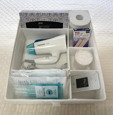 a drawer filled with various items in a box at #3 \u65b0\u5bbf\u307e\u30672\u5206! \u6e05\u6f54\u3067\u5b89\u5168\u306a\u90e8\u5c4b! WiFi\u7121\u6599! in Tokyo