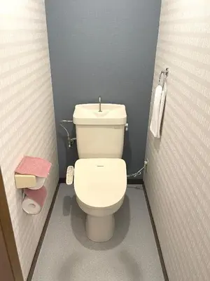 a bathroom with a white toilet in a stall at #3 \u65b0\u5bbf\u307e\u30672\u5206! \u6e05\u6f54\u3067\u5b89\u5168\u306a\u90e8\u5c4b! WiFi\u7121\u6599! in Tokyo