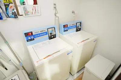 two refrigerators sitting next to each other in a room at GLOU Koiwa Tokyo - Economic APT in a Japanese Local Shopping Street, with Direct Access to Shinjuku & Akihabara in Tokyo