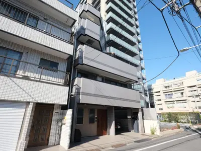 an apartment building on a city street at \u30d5\u30ea\u30fc\u30b8\u30a2\u6d45\u8349stay in Tokyo