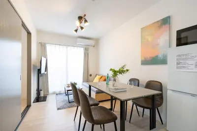 a kitchen and dining room with a table and chairs at \u30a6\u30a4\u30f3\u30d9\u30eb\u30bd\u30ed\u6771\u84b2\u7530 in Tokyo