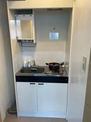 a small kitchen with a sink and a stove at Best location Private Kabukicho 2chome HigashiShinjuku Station 2min 58 m2 Super Convenient Shopping Gourmet Play in Tokyo