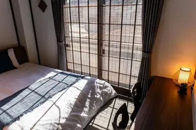 a bedroom with a bed and a large window at ONLY YOU HOTEL - Vacation STAY 02976v in Tokyo