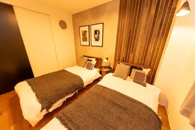 two beds in a small room with at ONLY YOU HOTEL - Vacation STAY 02976v in Tokyo