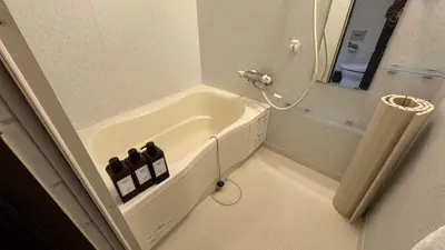 a bathroom with a sink and a bath tub at Sun Mall Crest - Vacation STAY 18546 in Tokyo