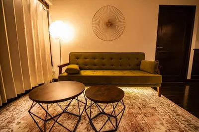 a living room with a couch and two tables at Sun Mall Crest - Vacation STAY 18546 in Tokyo