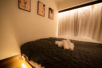a bedroom with two white towels on a bed at Sun Mall Crest - Vacation STAY 18546 in Tokyo
