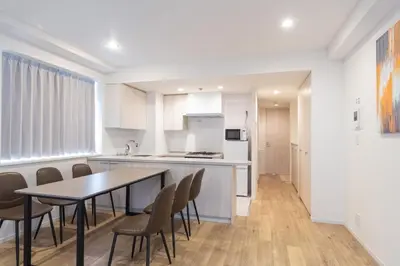 a kitchen and dining room with a table and chairs at \u5e83\u5c3e\u30a4\u30fc\u30b9\u30c8 in Tokyo