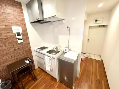 a small kitchen with a sink and a counter at \u798f\u83ef\u30d3\u30eb205\u53f7\u5ba4 in Tokyo
