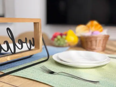 a table with a plate and a knife and fork at nestay villa tokyo akasaka in Tokyo