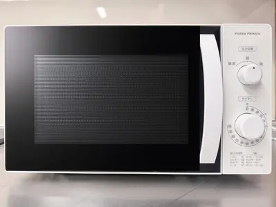 a microwave oven with its door open on a counter at nestay villa tokyo akasaka in Tokyo
