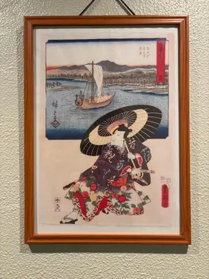 a framed picture of an eagle with a boat at Yoroi Asakusa Hotel in Tokyo