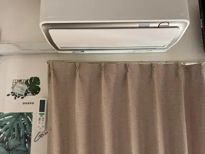 a bathroom with a shower curtain and a stove at kitashijyuku in Tokyo