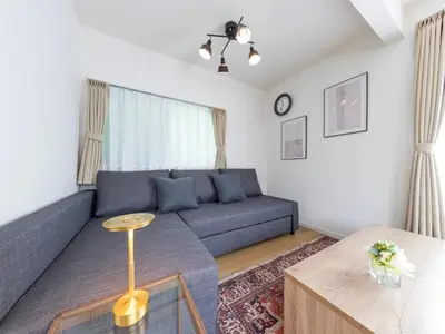 a living room with a couch and a table at Horikiri House, 3-story home, 15 guests, Free parking, 103sqm in Tokyo
