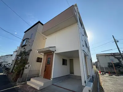 a small white building with a door on a street at Horikiri House, 3-story home, 15 guests, Free parking, 103sqm in Tokyo