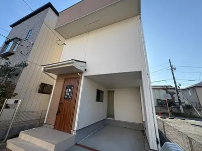 a white house with a wooden door and a porch at Horikiri House, 3-story home, 15 guests, Free parking, 103sqm in Tokyo