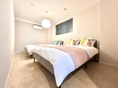 a bedroom with two beds and a window at Kojima House 1F-TT0168 in Tokyo