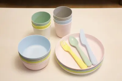 a table with a plate and two cups and a fork and knife at Emilio301 in Tokyo