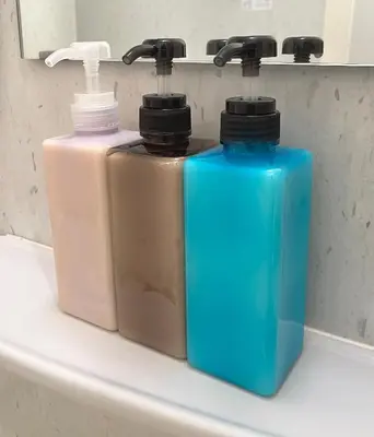 two bottles ofodorizers sitting on a bathroom sink at #5 WiFi無料&東新宿4分!歌舞伎町のホテルライク清潔部屋! in Tokyo