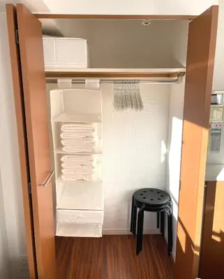 an empty refrigerator with its door open and a stool at #5 WiFi無料&東新宿4分!歌舞伎町のホテルライク清潔部屋! in Tokyo