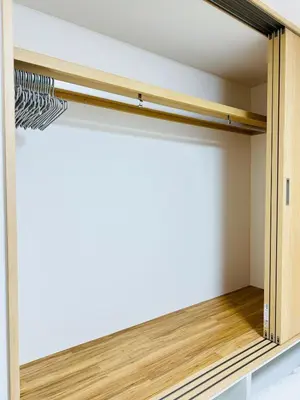a sliding closet door in a room with wooden floors at asakusa \u5343\u675f in Tokyo