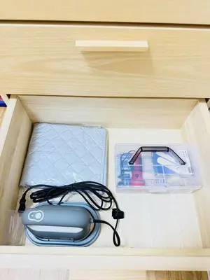 a drawer with a computer mouse and other items in it at asakusa \u5343\u675f in Tokyo