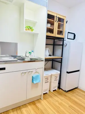 a kitchen with a sink and a refrigerator at asakusa \u5343\u675f in Tokyo