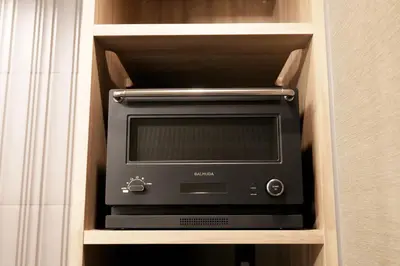 a microwave oven sitting inside of a cabinet at GRAND MONday GINZA in Tokyo