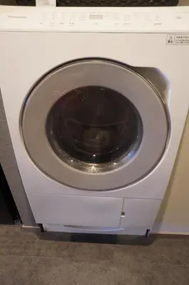 a white washing machine with its door open at GRAND MONday GINZA in Tokyo