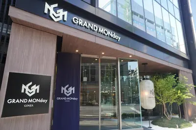 a building with a sign on the front of it at GRAND MONday GINZA in Tokyo