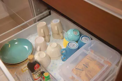 a refrigerator filled with dishes and utensils at \u65e5\u548c komagome in Tokyo