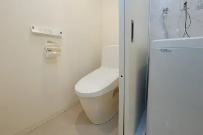 a bathroom with a toilet in a room at Ra Grande by Tranova in Tokyo