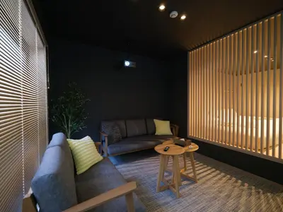 a living room with a couch and a table at T-home\u96c6 T-home SHU in Tokyo