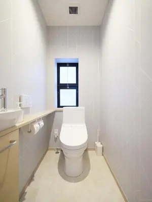 a bathroom with a white toilet and a window at T-home\u96c6 T-home SHU in Tokyo