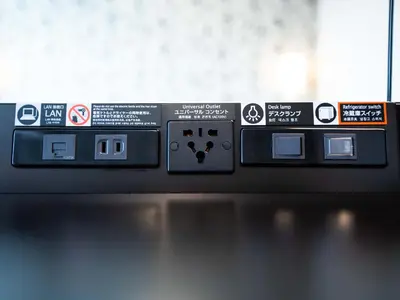 a close up of a machine with signs on it at APA Hotel Omori Ekimae Higashi in Tokyo